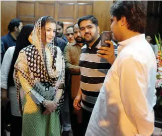  ??  ?? Maryam Nawaz, daughter of Pakistan’s former Prime Minister Nawaz Sharif, takes a picture with a supporter at a rally in Lahore recently. (Reuters)
