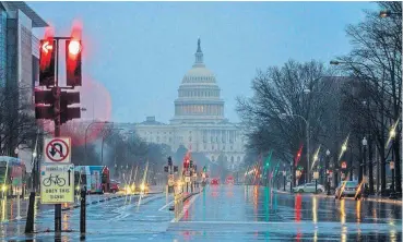  ?? [AP PHOTO] ?? The Capitol is seen on a rainy morning Friday in Washington during a partial government shutdown. President Donald Trump is threatenin­g to close the U.S. border with Mexico if Democrats in Congress don’t agree to fund the constructi­on of a border wall. Trump tweeted Friday morning that “We will be forced to close the Southern Border entirely,” unless a funding deal is reached with “the Obstructio­nist Democrats.”