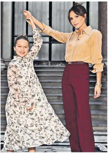 ??  ?? Victoria Beckham with her daughter, Harper, at the former Spice Girl’s spring-summer 2020 show for London Fashion Week. Eight-year-old Harper, wearing a floral print dress, joined her father David and brothers on the front row for the show