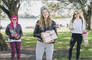  ??  ?? FEELING FESTIVE Roberta Allgood, Lauren Game and Sarah Jones-Bierton finally exchange Christmas gifts