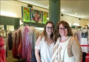  ?? Mackenzie Carpenter/Post-Gazette ?? Rochelle Dutt, right, of Doylestown, Ohio, and her 18-year-old daughter, Abby, are on the hunt for a prom dress at The Winner in Sharon, Mercer County.