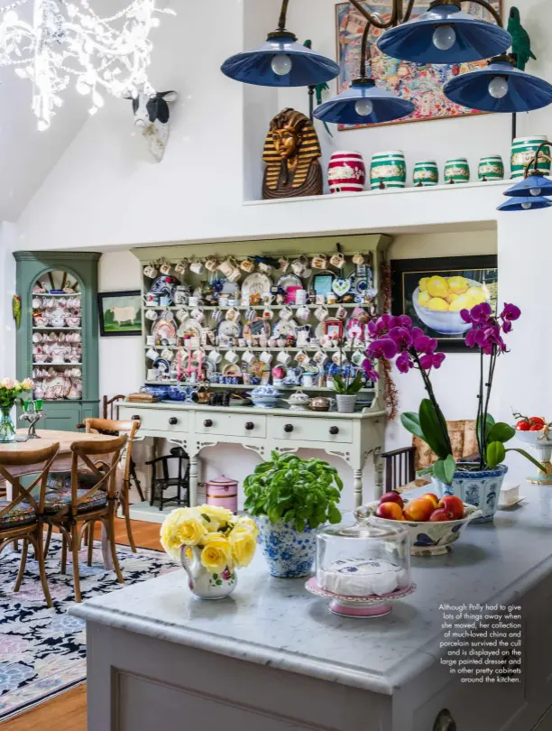  ??  ?? Although Polly had to give lots of things away when she moved, her collection of much-loved china and porcelain survived the cull and is displayed on the large painted dresser and in other pretty cabinets around the kitchen.