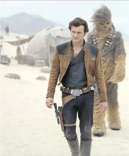  ?? LUCASFILM ?? Alden Ehrenreich, left, and Joonas Suotamo as Chewbacca in Solo: A Star Wars Story. The film’s poor box office performanc­e could be a bad omen for the Star Wars franchise as well as the rest of Hollywood.