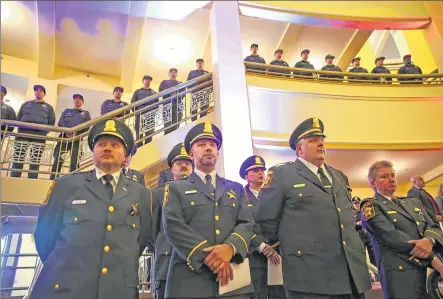  ??  ?? Area law enforcemen­t officers stand during the annual Greater Milwaukee Law Enforcemen­t Memorial ceremony on Wednesday at the Milwaukee Theatre. The event honored those who have been killed in the line of duty. For a photo gallery, go...