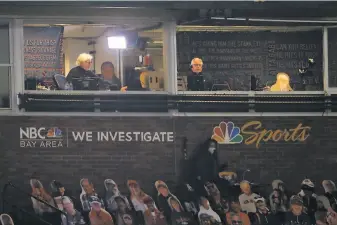  ?? Scott Strazzante / The Chronicle ?? Giants broadcaste­rs Mike Krukow (left) and Duane Kuiper before a game at Oracle Park earlier this month. This season they are separated by plexiglass due to the pandemic.