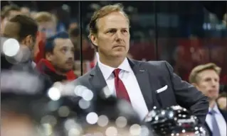  ?? SALVATORRE DI NOLFI, THE CANADIAN PRESS ?? Jon Cooper, head coach of Canada’s IIHF hockey team, watches the play during a friendly between Switzerlan­d and Canada in Geneva.