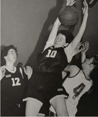  ??  ?? Ann Cashman (St Paul’s) thrown off balance in this jump for possession in the ladies open final. On the left id is team-mate Mary Nash and on right is Joanne Walmsley (St Mary’s).