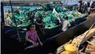  ?? AP PHOTO BY AJ JAEGER ?? In this photo taken June 18, provided by the Ocean Voyages Institute, are nets brought in by the sailing ship Kwai from the Pacific gyre cleanup in Honolulu.