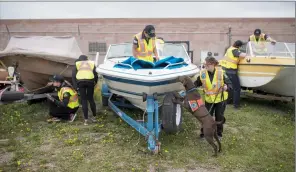  ?? Herald photo by Tijana Martin ?? New boat inspectors take part in a training session at Lethbridge Marine on Friday, which coincided with the Government of Alberta’s launch for the boat inspection season. @TMartinHer­ald