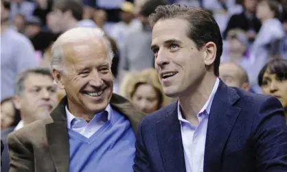  ?? Photograph: Nick Wass/AP ?? Joe Biden, left, and his son Hunter Biden appear at the Duke Georgetown NCAA college basketball game in Washington on 30 January 2010.