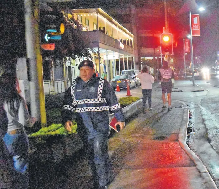  ?? Picture: FILE ?? A policeman on foot patrol along Victoria Pde in Suva where sex workers are often seen in the night.