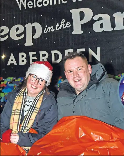  ??  ?? Odelle Conlon and Stuart Lobban join the sleep out in Aberdeen’s Duthie Park last night