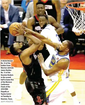  ?? AFP PHOTO ?? Kevin Durant No. 35 of the Golden State Warriors defends James Harden No. 13 of the Houston Rockets in the second half in Game One of the Western Conference Finals of the 2018 NBA Playoffs at Toyota Center on Tuesday in Houston, Texas.