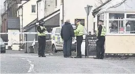  ??  ?? HORROR Villagers were stunned as police stormed the quiet streets after death