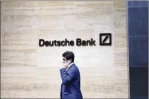  ?? NATASHA LIVINGSTON­E / ASSOCIATED PRESS ?? Germany’s struggling Deutsche Bank says it will cut 18,000 jobs by 2022, saying it is going “back to our roots” with a radical restructur­ing plan.