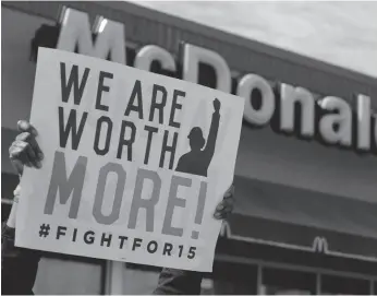  ?? AP FILE PHOTO ?? McDonald’s workers and supporters rally outside a McDonald’s in Chicago on April 15, 2015. A similar protest was held outside McDonald’s headquarte­rs in Chicago on Monday.