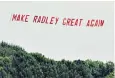  ??  ?? Angry pupils flew a banner over the school