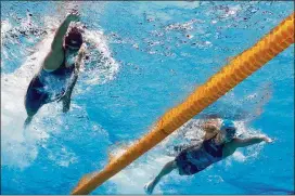  ?? CLIVE ROSE / GETTY IMAGES ?? Katie Ledecky of the United States (left) came up short in her pursuit of a sixth gold medal at the swimming world championsh­ips in Budapest.