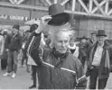  ?? PETER DEJONG/AP ?? Activists take their hats off Monday in The Hague, Netherland­s, in a show of respect for people who took their own lives.