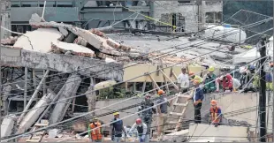  ?? AP PHOTO ?? Search and rescue efforts continue at the Enrique Rebsamen school that collapsed after an earthquake in Mexico City, Wednesday.