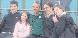  ??  ?? Stephen during his 615-mile trek, and (right) at the finish line with his wife Nicole and children, Paddy, Rosa andClara