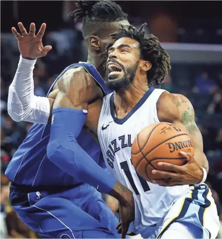  ??  ?? Grizzlies guard Mike Conley, right, missed most of last season with an injury. MARK WEBER/THE COMMERCIAL APPEAL