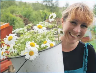  ?? Photograph: Iain Ferguson, ?? Sasha with her home grown flowers. alba.photos