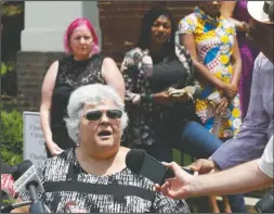  ?? The Associated Press ?? VERDICT: Susan Bro, mother of Heather Heyer, who was killed during the Unite the Right rally in
2017, speaks to reporters after the sentencing of James Alex Fields Jr., at General District Court in Charlottes­ville, Va., Monday. Fields was sentenced to life plus
419 years for his role in the
2017 Night The Right rally.