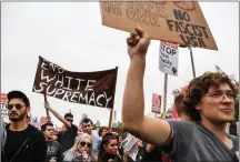  ?? Washington Post photo by Salwan Georges ?? Counter-protesters gather at Malcolm X Boulevard before marching to the Boston Common ahead of the Free Speech rally on Saturday in Boston.