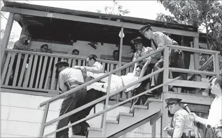  ?? Hugh Arnott Los Angeles Times / UCLA Archive ?? AURORA VARGAS is forcibly removed from her home in Chavez Ravine by Los Angeles County sheriff’s deputies in 1959, after her family refused to leave. More than 1,000 families were evicted for the seizure of the land eventually used to build Dodger Stadium.