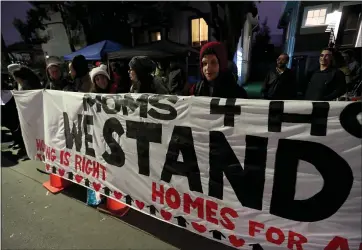  ?? STAFF FILE PHOTO ?? Moms 4Housing supporters protest in front of a vacant house in West Oakland. Members of the group have been illegally occupying the home since November to bring attention to affordable housing issues. “I think we’re going to look back in five or 10years and see that the Moms 4Housing victory was a turning point in California housing history,” a housing expert says.