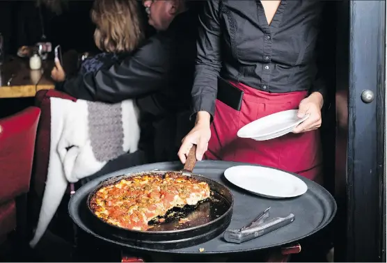  ?? PHOTOS: HUGE GALDONES/THE WASHINGTON POST ?? According to food reporter Steve Dolinsky, deep dish pizza is not the pie style of choice for real Chicagoans. Tavern-style is more popular.