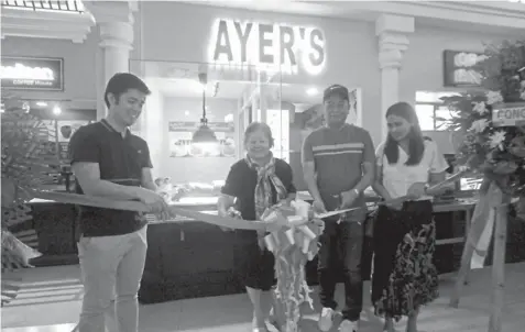  ??  ?? Ariel and wife Grace Palcuto with Atty. Cynthia Barte and JCenter Asst. Mall Manager Aurel Go during the opening ceremony of the 11th branch of Ayer’s Lechon inside JCenter Mall's Food Central. ALDO NELBERT BANAYNAL