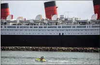  ?? JAY L. CLENDENIN — VIA TRIBUNE NEWS SERVICE ?? The Queen Mary is docked in Long Beach, Calif., on May 25. The city is looking for bidders interested in buying the ship’s lifeboats, which were removed as part of a $5million repair project.