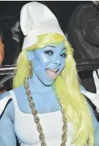  ?? MIKE COPPOLA/GETTY IMAGES ?? Ashanti was Smurfette at Heidi Klum’s 16th annual Halloween Party.