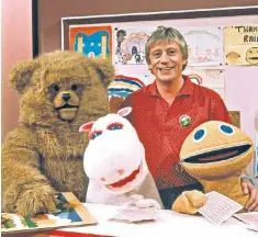  ??  ?? Hayes with Bungle, George and the hyperactiv­e Zippy, for all of whom he was a kindly but long-suffering mentor