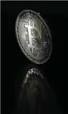  ?? BLOOMBERG PIC ?? Bitcoin, which has received a US$1.5 billion investment from Tesla Inc, may hit US$100,000 by year end.