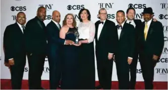  ??  ?? The cast and crew of "August Wilson's Jitney" pose in the press room with the award for best revival of a play.