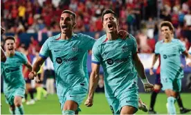  ?? Photograph: Ander Gillenea/AFP/Getty Images ?? Robert Lewandowsk­i (centre right) celebrates with Ferran Torres after his match-winning penalty.