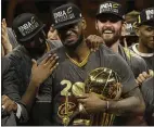  ?? AP PHOTO/MARCIO JOSE SANCHEZ, FILE ?? Cleveland Cavaliers forward LeBron James, center, celebrates with teammates after Game 7 of basketball’s NBA Finals against the Golden State Warriors in Oakland, Calif., June 19, 2016.