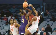  ?? RON JENKINS/AP ?? Houston guard Marcus Sasser blocks a shot by East Carolina guard RJ Felton during an American Athletic Conference quarterfin­al Friday in Fort Worth, Texas.