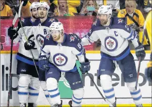  ?? AP PHOTO ?? Winnipeg Jets left wing Kyle Connor (81) celebrates with Josh Morrissey, Mark Scheifele and Blake Wheeler, from left, after Connor scored a goal against the Nashville Predators during the second period in Game 5 of an hockey second-round playoff series...