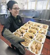  ?? Mel Melcon Los Angeles Times ?? ANITA GONZALES prepares oven-roasted drumsticks for Belvedere Elementary students last month.