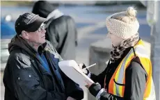  ?? JOHN LUCAS/EDMONTON JOURNAL ?? Gilles Careau answers volunteer Krista Brower’s questions during Thursday’s Homeless Count in Edmonton.