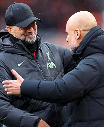  ?? GETTY IMAGES ?? Respect: Klopp (left) and Guardiola hug at the end of their final Premier League clash