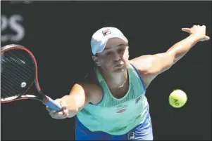  ?? The Associated Press ?? REACH AND RETURN: Australia’s Ash Barty makes a forehand return to Petra Kvitova of the Czech Republic during their quarterfin­al match at the Australian Open on Jan. 28 in Melbourne, Australia. Top-ranked Ash Barty has withdrawn from the U.S. Open because she is not comfortabl­e with traveling during the coronaviru­s pandemic.