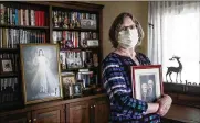  ?? JIM NOELKER / STAFF ?? Mary Sutton holds a picture of her mother, Alvera Gudorf, who died of COVID-19 at Koester Pavilion nursing home in Tipp City. “She was tough as nails,” Sutton said. “She was going to go out kicking and screaming and then COVID-19 came along.”