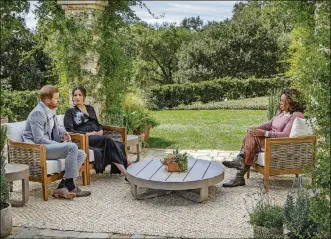  ?? JOE PUGLIESE/HARPO PRODUCTION­S VIA AP ?? This image provided by Harpo Production­s shows Prince Harry, from left, and Meghan, the Duchess of Sussex, in conversati­on with Oprah Winfrey.