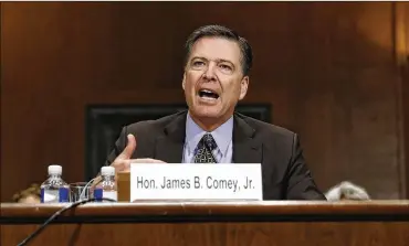  ?? CAROLYN KASTER / ASSOCIATED PRESS ?? FBI Director James Comey testifies on Capitol Hill on Wednesday. “It makes me mildly nauseous to think we might have had some impact on the election. But honestly it wouldn’t change the decision.”