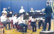  ?? Westside Eagle Observer/MIKE ECKELS ?? The Decatur High School band plays the national anthem during the eighth annual Decatur High School Veterans Day Celebratio­n at Peterson-Owens Fieldhouse in Decatur Thursday morning.